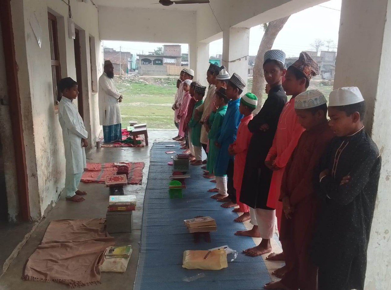 Students reciting dua